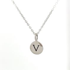 Best selling Initial Pendant Necklace made out of Recycled Sterling Silver. Initial Pendant hangs on 16 inch Sterling Silver Cable Chain that is Lead and Nickel Free. Wear as a monogram or add gems, charms or birthstones to make it more personal and unique! All initials available A-Z Recycled Sterling silver from Thailand Sterling Silver Cable Chain from USA, Lead and Nickel Free The initial charm is approximately 3/8" in diameter. Birthstone and gemstone charms sold separately Small Personalized Charm Necklaces For Everyday, Personalized Small Charm Necklaces For Everyday, Sterling Silver Round Initial Necklace For Birthday, Everyday Nickel Free Initial Pendant Charm Necklaces, Small Personalized Sterling Silver Necklace, Classic Sterling Silver Hand Stamped Necklaces, Classic Hand Stamped Sterling Silver Necklaces, Everyday Nickel-free Charm Necklace With Round Pendant, Nickel Free Round Pendant Charm Necklace