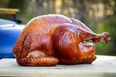 a whole turkey sitting on a cutting board