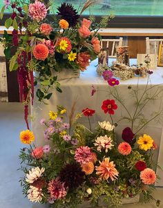 an arrangement of colorful flowers on a table