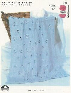 the knitting pattern for a baby afghan is shown in blue and has a white crochet