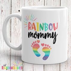 rainbow mommy coffee mug with the words rainbow on it and two feet imprinted into each other