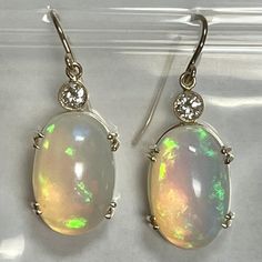 Vintage 14k yellow gold 15.73ct opal, .35ct diamond 6.2 grams In store now and available to ship within 1-2 business days Formal Opal Gemstone Earrings, Oval Opal Earrings For Formal Occasions, Formal Oval Opal Earrings, Formal Opal Round Earrings, Formal Round Opal Earrings, Jemma Wynne, Rainbow Gemstones, Earring Sale, Chain Pendants