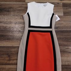 Beautiful Calvin Kline Colorblock Pencil Dress In Size 6 - New With Tags! The Dress Has The Colors: Cream, Tan, Black, And Redish Coral Like Color. The Inside Label Is Loose On One Side (See Pics) But Does Not Affect The Dress In Any Way. Measures 38in From Shoulder To Hem. Smoke-Free Home. ***Offers Welcome*** Multicolor Color Block Dresses For Workwear, Multicolor Sheath Dress For Work, Fitted Color Block Work Dresses, Color Block Fitted Dress For Work, Fitted Color Block Dress For Work, Calvin Klein Dresses, Pencil Dress, Womens Calvin Klein, Pretty Dresses