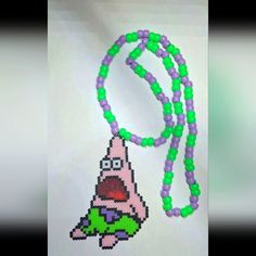 a beaded necklace with an image of a cartoon character hanging from it's side