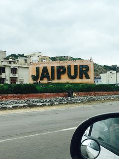 a large sign that reads jalpur on the side of a road