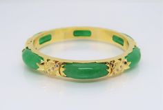 Vintage 18K Solid Yellow Gold Translucent Green Jadeite Jade & White Topaz Bamboo Bangle Bracelet ....Marked 18K...Total of weights 30.8grams...Measure inside 53MM W 8.1MM...With 06 Green Jades 21.5 x 7.5MM ...It's in very good condition. #475680 Luxury Green Gemstone Bangle, Green Multi-stone Round Bracelets, Luxury Green Bangle For Anniversary, Fine Jewelry Green Bangle For Anniversary, Green Fine Jewelry Bangle For Anniversary, Green Gemstone Bangle For Anniversary, Anniversary Green Gemstone Bangle, Green Multi-stone Bangle Jewelry, Bamboo Bangle