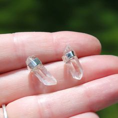 I handcraft these small quartz crystal points earrings with a sterling silver bezel wrap. Each crystal is left in it's raw natural state. The beauty and simplicity of these earrings goes along way! Each pair is unique and made just for you. Examples The first four Pictures show a pair measuring about 5/8" with a centered bezel. (5th picture shows a pair with the bezel near the top...if you would like the bezel near the top please let me know at checkout. 6th picture is showing a much shorter pai Raw Crystal, Crystal Points, Post Earrings, Quartz Crystal, Sapphire Ring, Sapphire, Let Me, Engagement Rings, Crystals