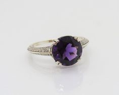 Vintage Sterling Silver Round cut Amethyst Ring...Marked 925...Total of weights 2.5grams... Size 9...Measure of stone 10MM...It's in very good condition. Classic Diamond Cut Purple Amethyst Ring, Round Amethyst Ring With Diamond Cut, Classic Amethyst Diamond Cut Ring, Topaz Engagement Ring, Filigree Ring, Amethyst Ring, Perfect Ring, White Topaz, Vintage Sterling Silver