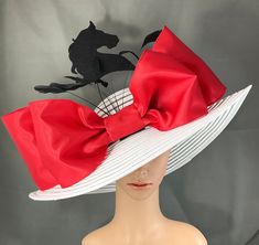 Gorgeous Kentucky Derby Hat   Ready to ship  100% Brand New  Designed & Made in USA         This gorgeous hat has a 22.5 inches interior crown circumference.The Brim is 5 3/4 inches. It fits most! Hat Base Color: White  Bow color: Red ( about 13 inches in width) Handmade Felt Horse : Black (6 inches in height) with millinery wire  Feather color: Black  Hat band: Black  This is a high quality wide brim hat with wire which could hold it's shape.It won't flop in the eyes and face. Would be great fo Luxury Red Fedora For Kentucky Derby, Luxury Red Hat For Kentucky Derby, Luxury Red Hat Bands For Kentucky Derby, White Pinched Crown Hat For Kentucky Derby, Classic Kentucky Derby Hat With Structured Crown, Red Brimmed Hat For Church, Red Brimmed Church Hat, Red Short Brim Hats For Church, Kentucky Derby Hats With Pinched Crown For Races