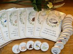 a bunch of cards sitting on top of a wooden table