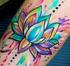 a colorful lotus tattoo on the leg