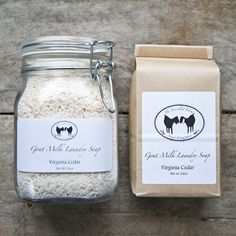 a glass jar filled with white rice next to a bag of brown sugar on top of a wooden table