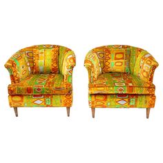 a pair of colorful chairs sitting next to each other