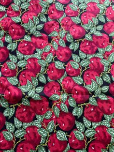 red apples with green leaves on a black background, printed in bright colors and sequins