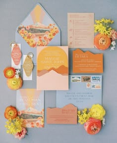 the wedding stationery was done in peach, yellow and blue with an orange theme