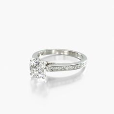 a diamond engagement ring on a white background