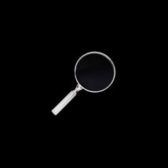 a magnifying glass on a black background with no image in the bottom right corner