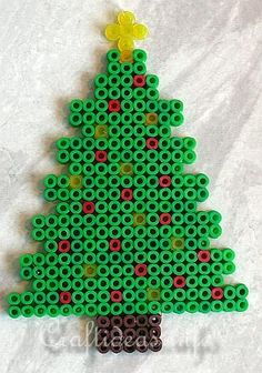 a christmas tree made out of legos on top of a sheet of white paper