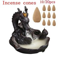 incense cones in the shape of a dragon on a rock with water pouring out of it