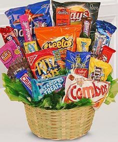 a basket filled with assorted candy and snacks