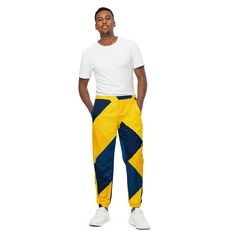 The unisex track pants are your new go-to piece for working out or styling a streetwear outfit. The water-resistant, lightweight fabric and mesh lining provide comfort, while elastic ankle cuffs will make it easy for you to show off your kicks. Style it with a windbreaker for a complete look and feel. * 100% polyester * Fabric weight: 2.21 oz/yd² (75 g/m²) * Lightweight, water-resistant fabric * Fully lined, mesh lining  * Relaxed fit * Elastic waistband and ankle cuffs * Zip pockets * Sits at h Nylon Sweatpants With Side Pockets For Jogging, Nylon Sportswear Cargo Pants For Sports, Sportswear Nylon Cargo Pants For Sports, Nylon Sportswear Sweatpants With Side Pockets, Sportswear Nylon Sweatpants With Side Pockets, Urban Style Moisture-wicking Sweatpants For Sports, Urban Nylon Parachute Pants For Sports, Urban Style Nylon Parachute Pants For Sports, Nylon Sweatpants With Side Pockets For Sportswear