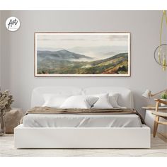 a bed with white sheets and pillows in a room next to a painting on the wall