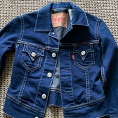 New Never Worn. Levi Strauss & Company Denim Jacket. 83%, Cotton, 15% Poly And 2% Spandex. Big Cross Written Out Over It. I Bought It For My Daughter Long Ago And She Never Wore It! Fitted Dark Wash Long Sleeve Outerwear, Fitted Denim Blue Outerwear With Snap Buttons, Levi's Fitted Denim Jacket For Work, Fitted Levi's Cotton Outerwear, Fitted Dark Wash Outerwear With Snap Buttons, Fitted Levi's Outerwear With Pockets, Levi's Fitted Long Sleeve Denim Jacket, Levi's Classic Fitted Denim Jacket, Classic Fitted Levi's Denim Jacket