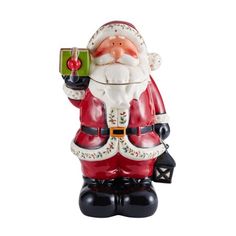 a santa clause figurine holding a gift box