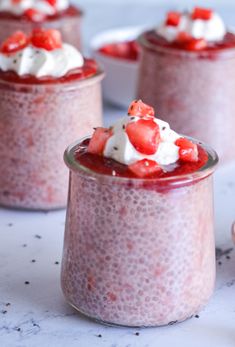 three small jars filled with food on top of a table