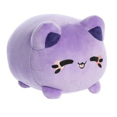 a purple stuffed animal with black eyes on it's face and nose, laying down