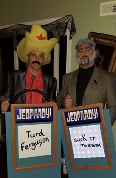 two men in costumes standing next to each other holding signs that say jeepparary