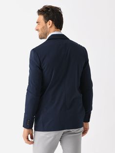 DESCRIPTION:For all-day, on-the-go comfort, this blazer has a tailored design while being easy to slip on and layer over a dress shirt, tee, or hoodie.FEATURES:Notch LapelLeft Chest PocketInterior PocketsFunctional CuffsFlap PocketsDouble Button ClosurePerformance Fabrication64% Organic Cotton, 31% COOLMAX® EcoMade Polyester, 5% ElastaneSlim FitModel is wearing size Medium blazer.Model's Measurements: Height: 6'2.5" | Waist: 34" | Inseam: 32" | Collar: 16" | Sleeve: 35" | Suit: 40L Navy Casual Outerwear For Semi-formal Occasions, Navy Sport Coat With Hidden Button Closure, Navy Casual Business Sport Coat, Casual Navy Blazer For Semi-formal Occasions, Casual Navy Blazer For Semi-formal Events, Navy Casual Sport Coat For Business Casual, Casual Navy Sport Coat With Notch Lapel, Navy Sport Coat For Business Casual In Fall, Fall Navy Sport Coat For Business Casual