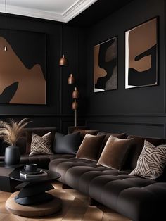 a living room with black walls and brown furniture