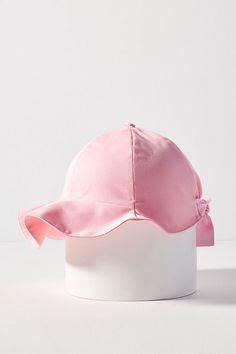 Please note that all sales are final. The Wavy Caplet is crafted with organic cotton and features an undulating brim with a playful fluttered edge. Its brim surrounds you, offering sun shielding for all your sunny adventures. It’s capped off with a signature covered button and gingham loop tab for a distinguished look. Go on…play! 100% organic cotton 100% recycled polyester ribbon straps Signature gingham loop tab Signature cover button top Pull-on elastic back closure Tie back straps for a cust Button Top, Back Strap, Tie Backs, Covered Buttons, Tie Back, Go On, Sunnies, Gingham, Anthropologie