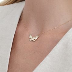 Yara Embrace the delicate beauty of nature with our 14k Gold Diamond Butterfly Necklace. This enchanting minimalist piece features a solid gold butterfly pendant, meticulously crafted to capture the intricate details of its wings. Natural diamonds are flush-set throughout the pendant, creating a subtle yet captivating sparkle that dances with every movement. - Handmade - Solid Gold - Natural Diamonds - G Color, SI Quality Diamonds - The Dimension of the Butterfly: 13.42 mm x 21.80 mm - Total Dia Diamond Butterfly Necklace, Mini Butterfly, Diamond Butterfly, Butterfly Pendant Necklace, Delicate Beauty, April Birthstone, Cute Butterfly, Everyday Necklace, Gold Butterfly