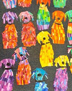 many different colored dogs made out of paper