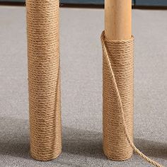 two rolls of twine tied together on the floor