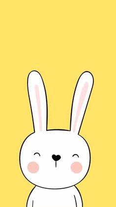 a white rabbit sitting in front of a yellow background