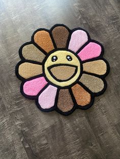 a colorful rug with a smiley face on it