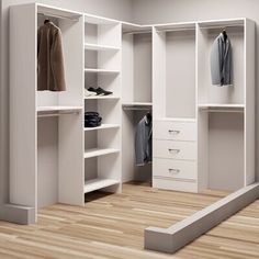 an empty walk in closet with white shelves and drawers