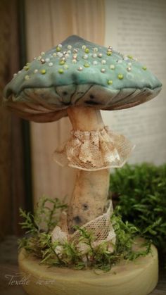 a blue mushroom sitting on top of a wooden table