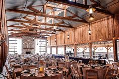 the inside of a restaurant with tables and chairs set up for an event or function