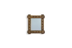 a wooden mirror hanging on the wall