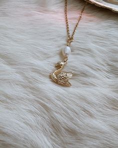 🦢  Please be aware that the pearl connector can range in sizes due to its natural nature. Some of the pearl connectors may be like the one you see in the photo and some may be a little bit bigger. This gorgeous swan necklace piece is truly one of a kind. Created with loving intentions as well. This piece makes for a wonderful gift for yourself or a loved one. 🌹 The swan charm is 18k gold stainless steel and the chain is 18k gold stainless steel.  The pearl hanging on the necklace is a real fre Aphrodite Jewelry, Venus Jewelry, Vintage Gold Jewelry, Swan Jewelry, Jewelry Pearl Necklace, Swan Pendant, Gold Swan, Swan Necklace, Feminine Jewelry