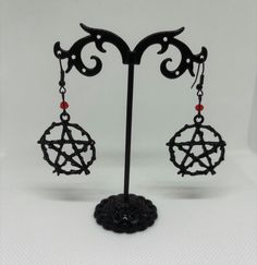 Brand new set of earrings. Symbolic Black Earrings For Gift, Symbolic Dangle Plug Earrings For Pierced Ears, Gothic Adjustable Earrings With Ear Wire, Adjustable Gothic Earrings With Ear Wire, Handmade Symbolic Black Earrings, Adjustable Gothic Earrings For Gift, Adjustable Gothic Earrings, Adjustable Gothic Style Earrings For Gift, Handmade Gothic Hoop Earrings As Gift