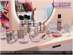 an assortment of cosmetics and makeup products on a table with a mirror in the background