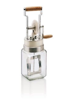 a food processor with a wooden handle on it's side and a glass container in the middle