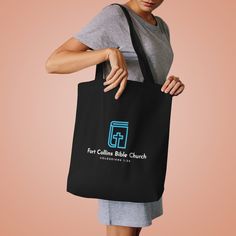 The cotton canvas tote bag is the ideal grab & go accessory. Made of 100% cotton, it features long, reinforced shoulder straps for exceptional comfort. This customizable, 42cm x 42cm tote fits right in with any style.  .: 100% cotton canvas .: Medium-heavy fabric (9.44 oz/yd² (320 g/m .: Reinforced shoulder straps .: One size Black Cotton Canvas Bag With Reinforced Handles, Black Cotton Shoulder Bag With Reinforced Handles, Cotton Tote Bag With Branding, Everyday Cotton Canvas Bag With Branding, Fort Collins, Cotton Tote Bag, Canvas Tote Bag, Cotton Tote Bags, Heavy Fabric