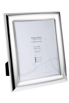 a silver plated photo frame on a white background