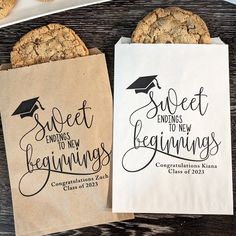 two paper bags with congratulations cookies on them